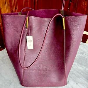 The Large Akimbo Tote Bag with matching zipper cosmetic case new with tags